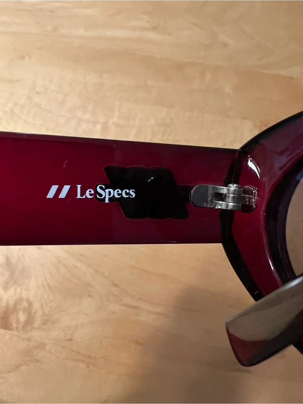 Le Specs Burgundy Oval Sunglasses with Dark Lenses